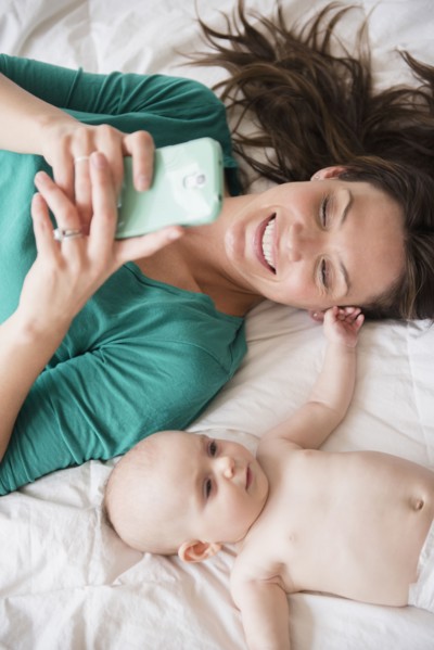 Mother taking selfie with baby daughter