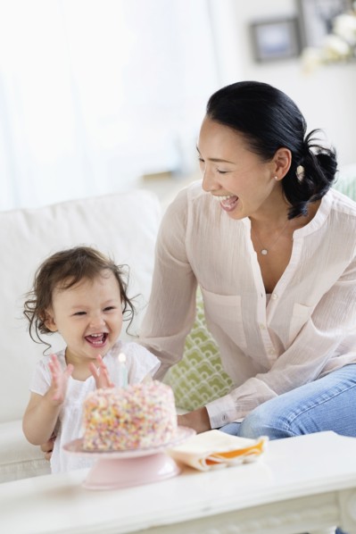 Mother and baby daughter celebrating birthday