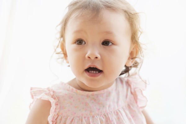 Mixed race baby girl with mouth open