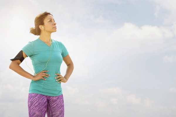 Mixed race runner standing outdoors