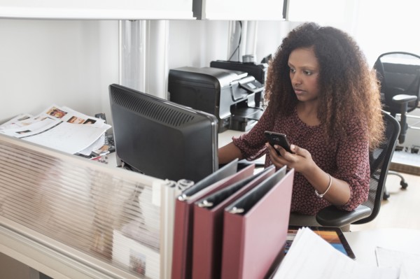 Black businesswoman working at office desk