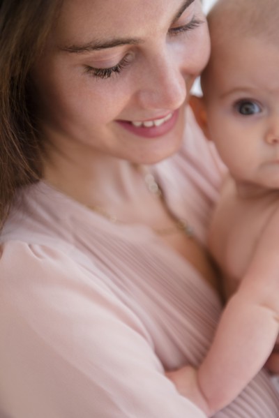 Close up of mother holding baby girl