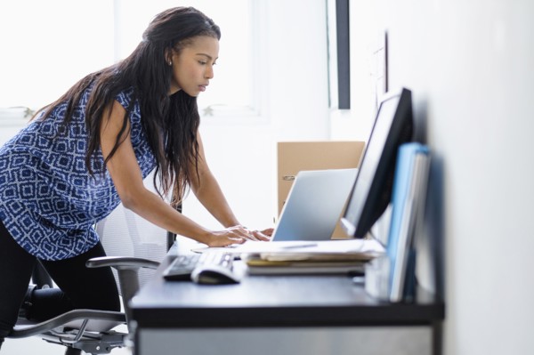 Mixed race businesswoman working in office
