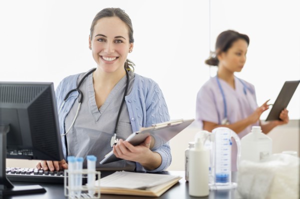 Nurse holding medical chart in hospital