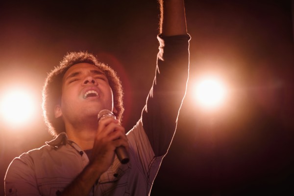 Mixed race singer performing on stage