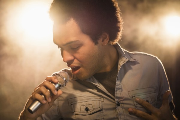 Mixed race singer performing on stage