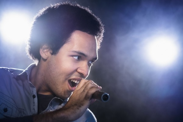 Mixed race singer performing on stage