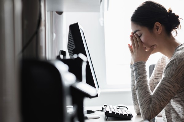 Hispanic woman using computer