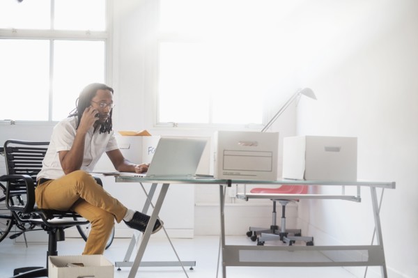 Black businessman working in new office