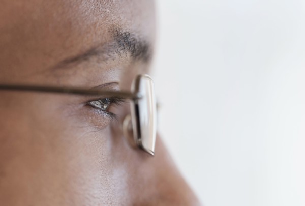Close up profile of eyes and eyeglasses of Black man