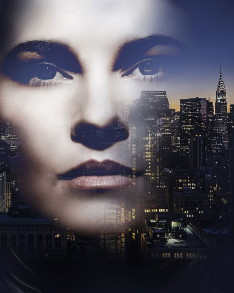 Face of Caucasian woman and New York cityscape
