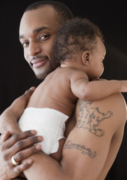 African man holding baby