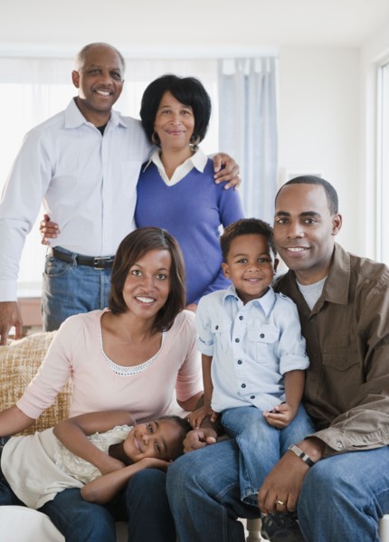 African American family sitting in living room
