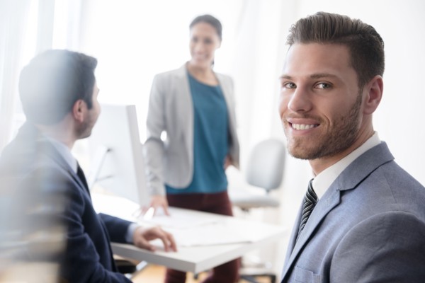 Portrait of smiling businessman in office