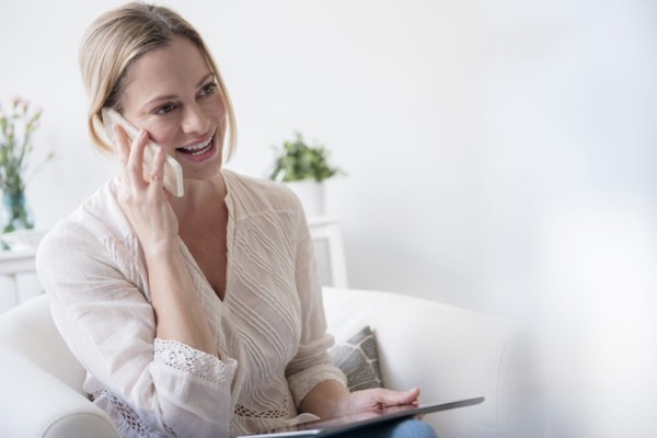 Caucasian woman talking on cell phone