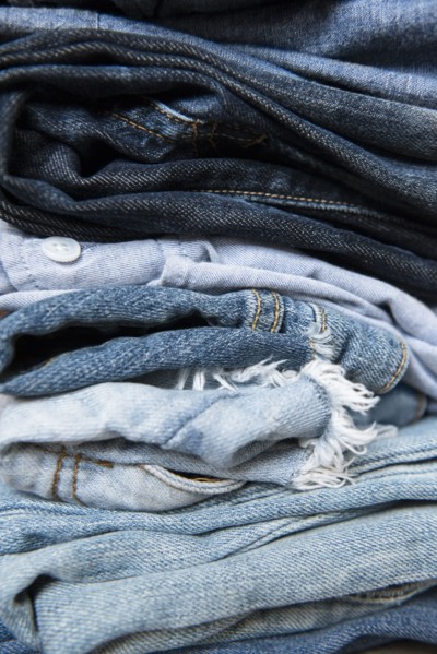 Stack of folded blue jeans