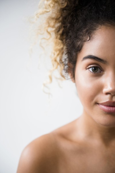 Portrait of Mixed Race woman with bare shoulders