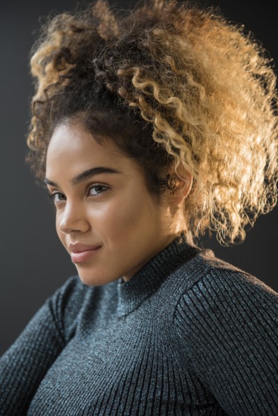 Portrait of Mixed Race woman wearing sweater