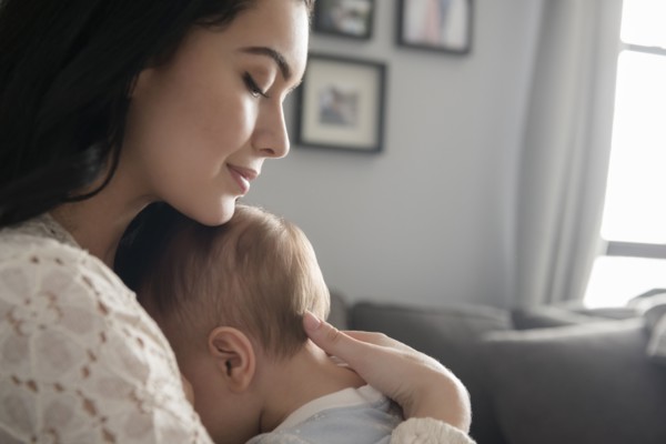Caucasian mother comforting baby son