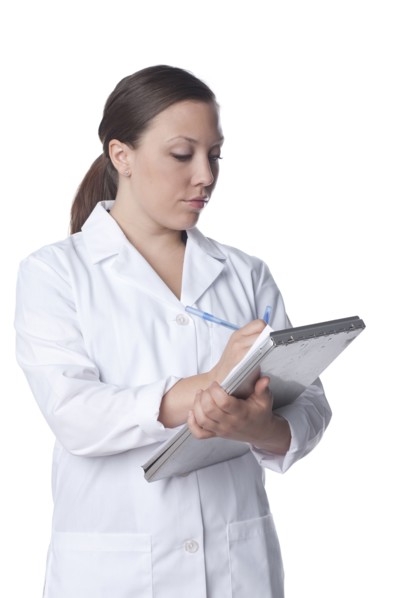 Caucasian doctor writing on medical record