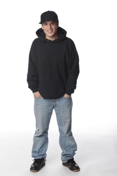 Mixed race man in sweatshirt and baseball cap