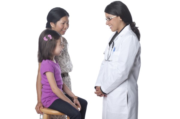 Doctor talking to mother and daughter
