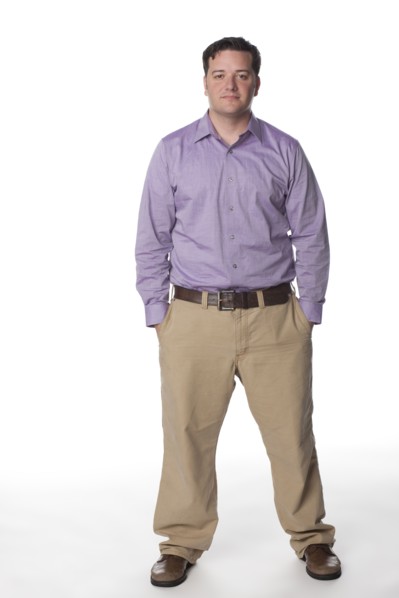 Serious Caucasian man with hands in pockets