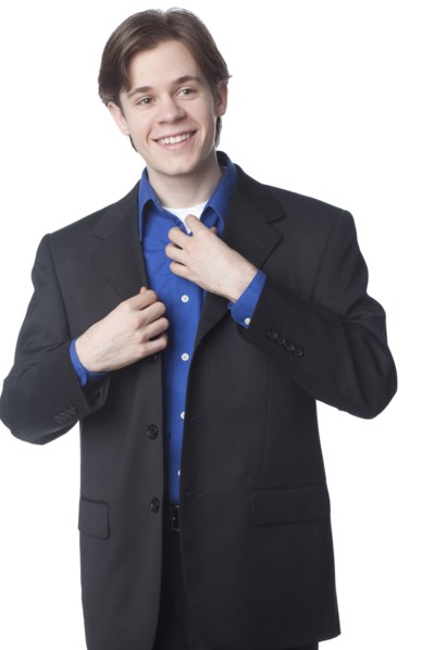 Caucasian businessman adjusting collar