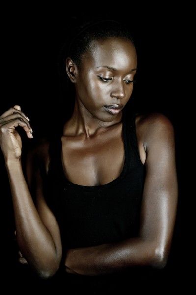 Serious African American woman looking down