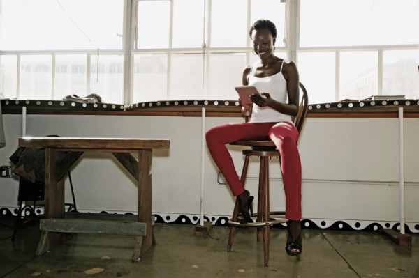 Black woman using digital tablet