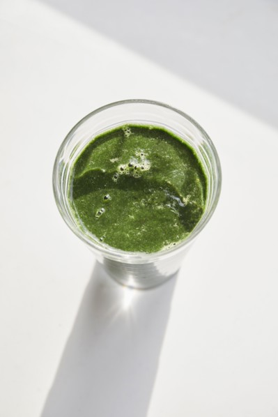 Overhead view of glass of green smoothie
