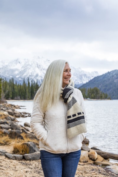 Smiling senior woman at mountain lake
