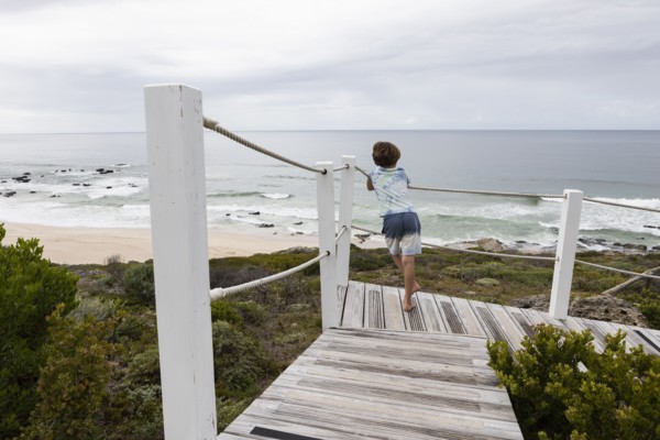 Boy looking at ocean view