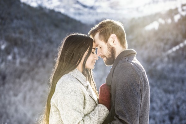 Couple hugging in Winter landscape