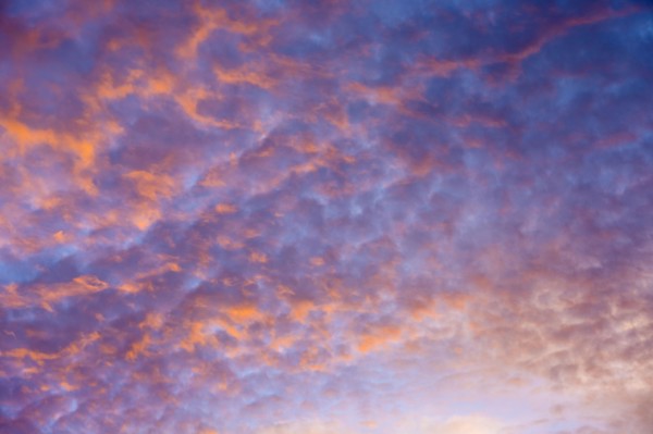 Sunrise sky with puffy clouds