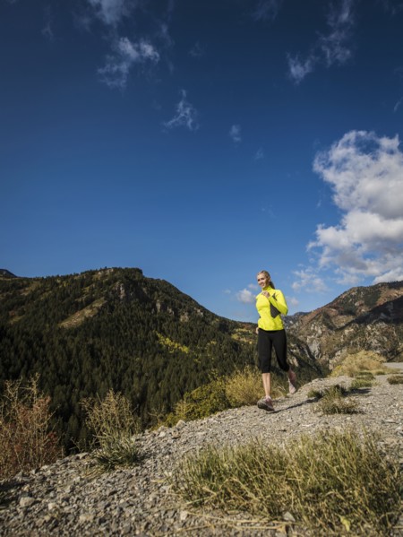Woman jogging in mountain landscape