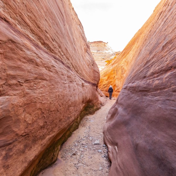 Senior hiker exploring slot canyon