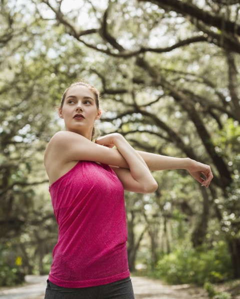 Woman stretching in park