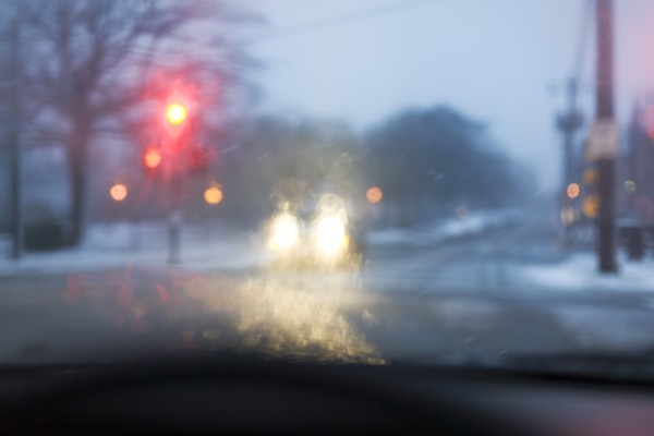 Street seen from car during snowstorm