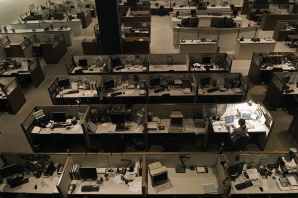 Woman working late at night in office
