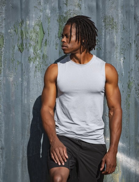Portrait of athlete man against wall