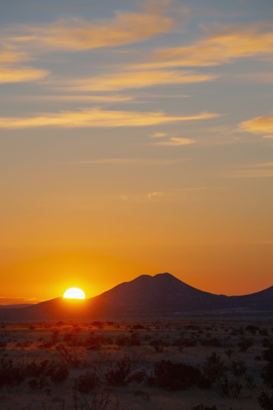Sun setting over hills in Cerrillos Hills State Park