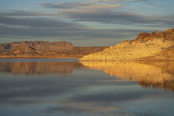 Rock formations reflected in water in Elephant Butte Lake State Park