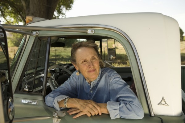 Senior woman in pick-up truck