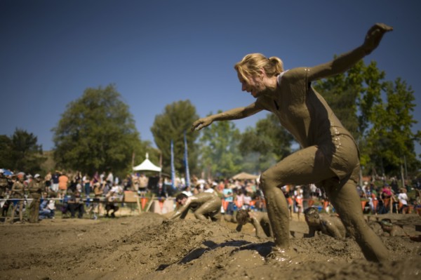 Sportswoman running in mud