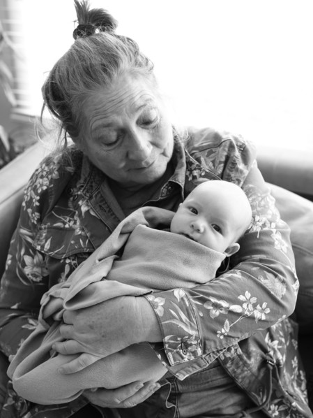 Grandmother holding newborn grandson