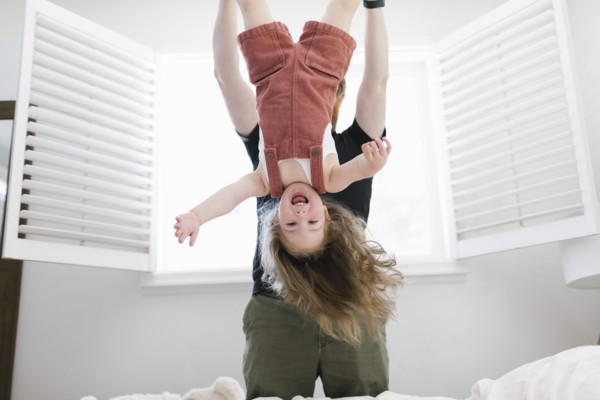 Father swinging daughter
