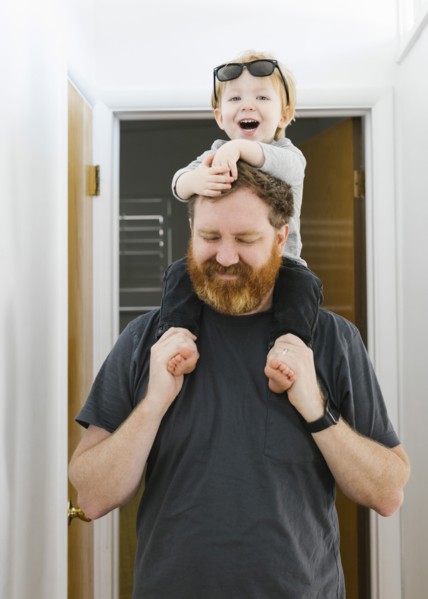Father carrying son