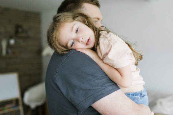 Father holding daughter