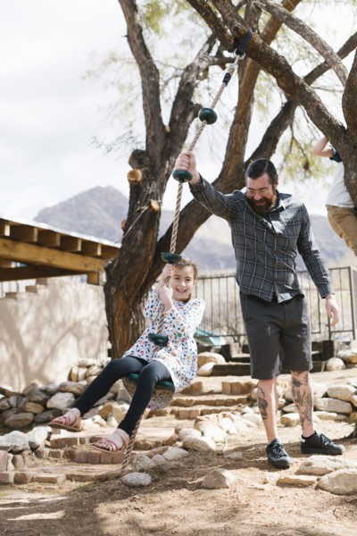 Father swinging daughter